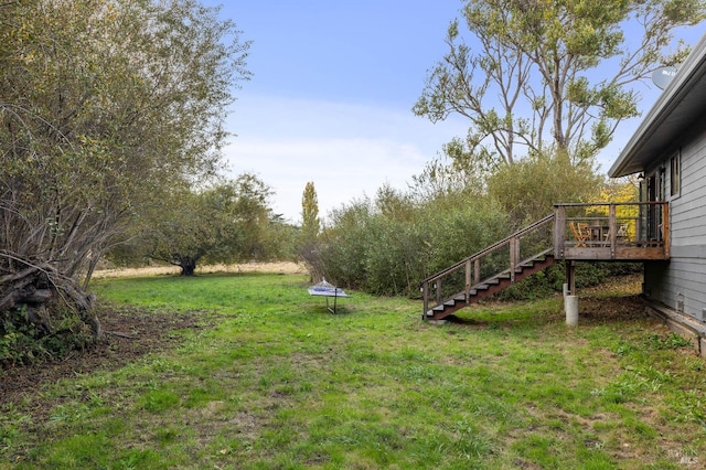 view of yard featuring a wooden deck