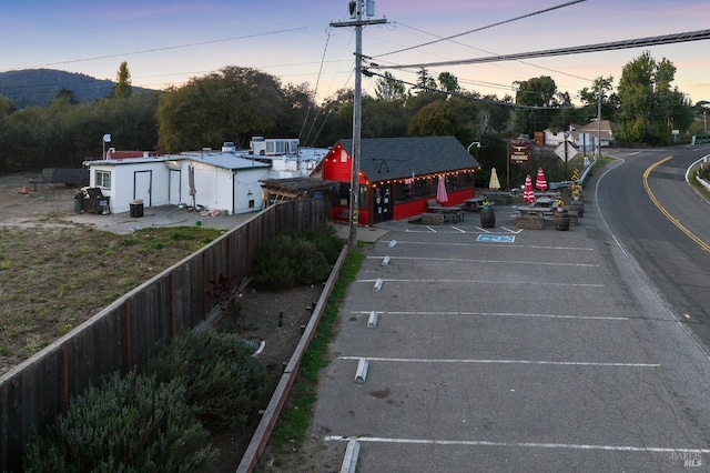 view of parking at dusk