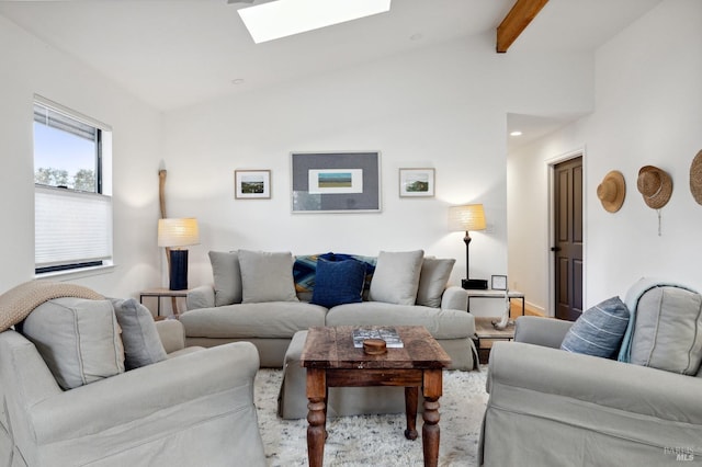 living room with lofted ceiling with skylight