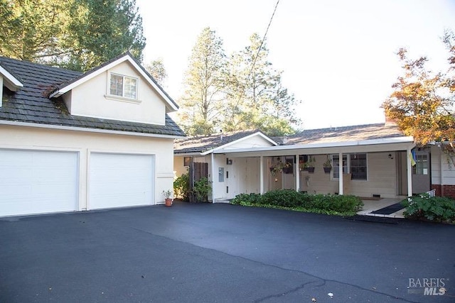 front facade with a garage