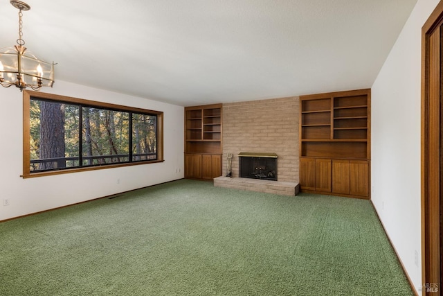 unfurnished living room featuring brick wall, carpet, and an inviting chandelier