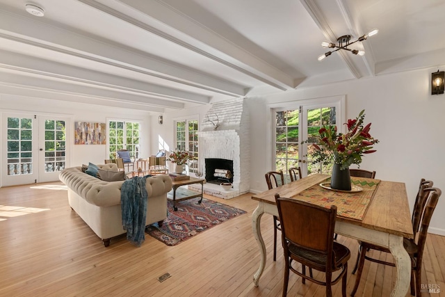 interior space with light wood-type flooring and french doors