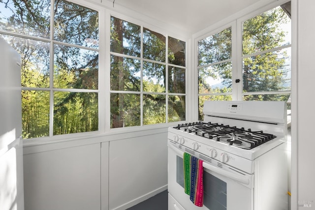 kitchen with gas range gas stove and white cabinets