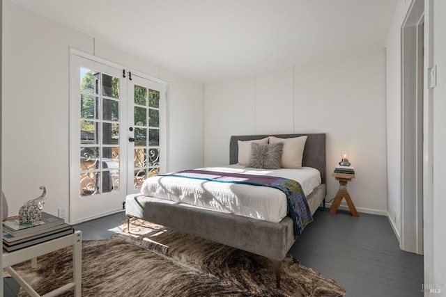 bedroom with dark wood-type flooring and french doors