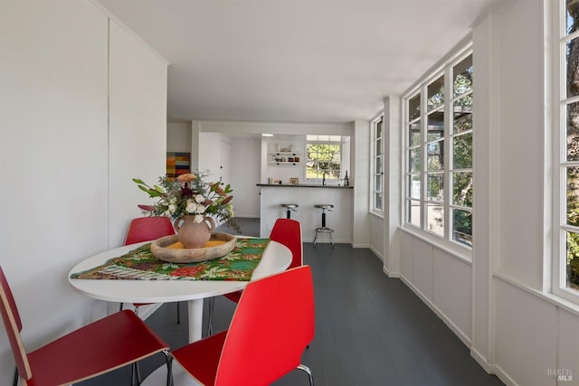 dining space with dark hardwood / wood-style floors