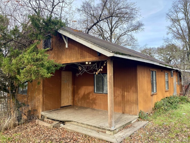 view of side of property with a deck