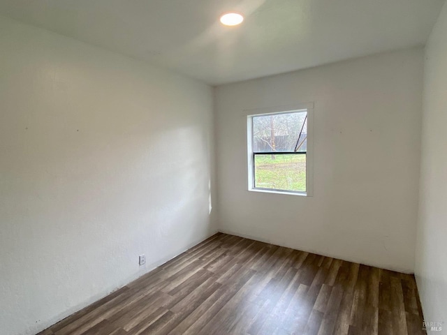 empty room with hardwood / wood-style floors