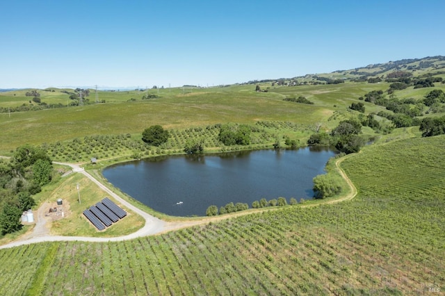 drone / aerial view featuring a water view and a rural view