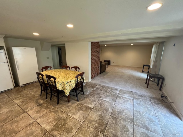 view of carpeted dining space