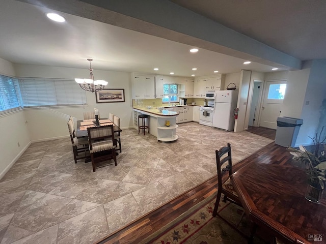 dining space with a chandelier