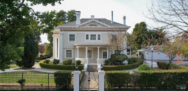 view of front facade with a porch and a garage