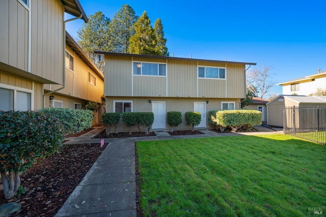 exterior space with a lawn and an outdoor structure