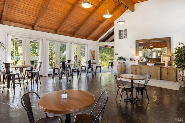 dining area with plenty of natural light, wood ceiling, high vaulted ceiling, and french doors