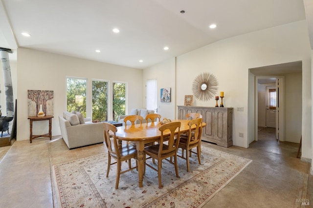 dining area with vaulted ceiling