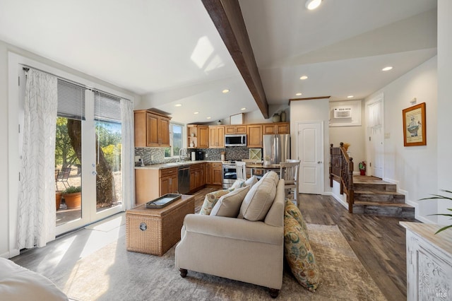 living room with sink, vaulted ceiling with beams, and hardwood / wood-style flooring