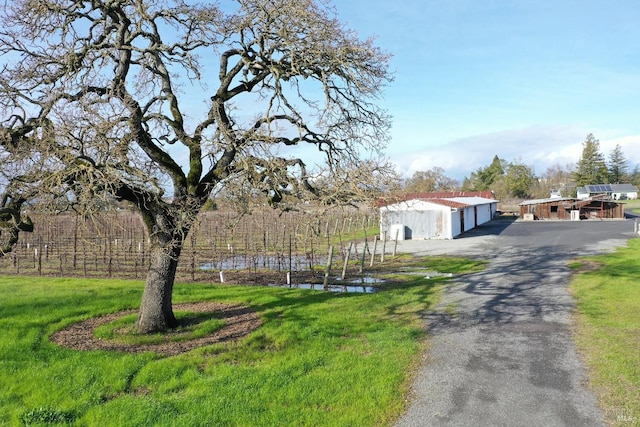 view of front of home with a front yard and a garage