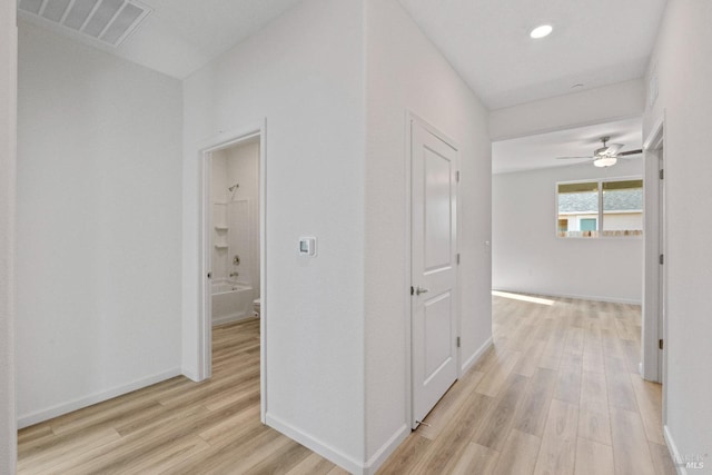 hallway featuring light hardwood / wood-style flooring