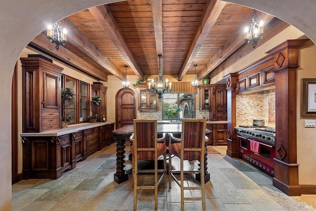 tiled dining space featuring an inviting chandelier, beamed ceiling, and wooden ceiling