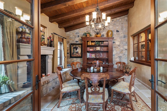 tiled dining space with wooden ceiling, a notable chandelier, beamed ceiling, and french doors