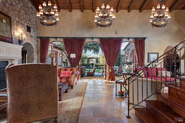 interior space featuring wooden ceiling, tile floors, a chandelier, beamed ceiling, and a high ceiling