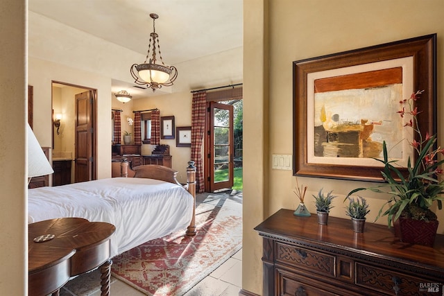 bedroom with access to outside and light tile floors