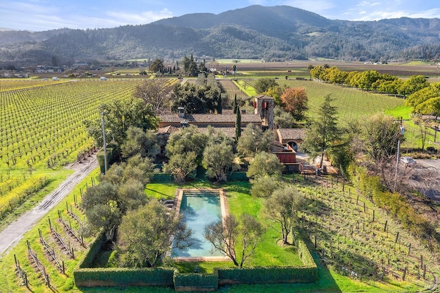 bird's eye view with a mountain view and a rural view