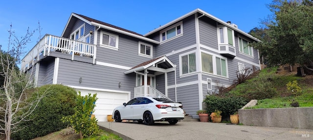 view of front of house with a balcony and a garage