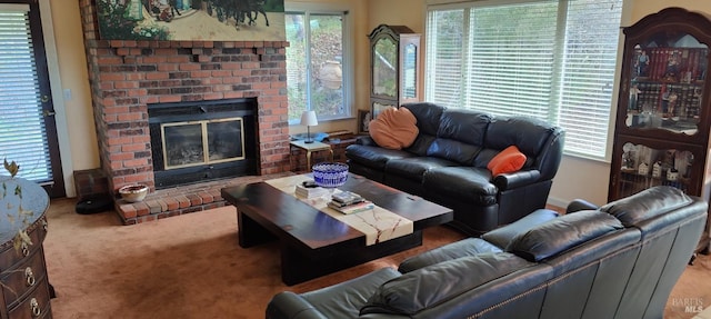 carpeted living room featuring a wealth of natural light and a fireplace