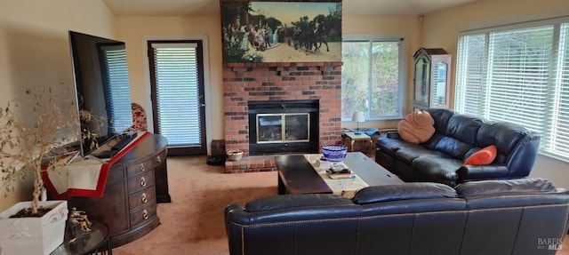 carpeted living room with plenty of natural light and a brick fireplace