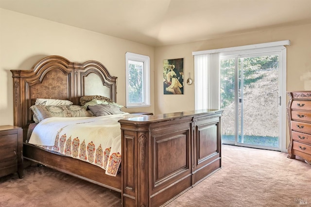 carpeted bedroom featuring access to outside