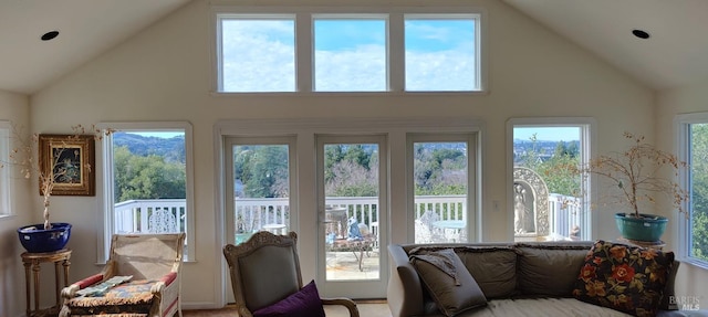 sunroom / solarium with plenty of natural light and vaulted ceiling