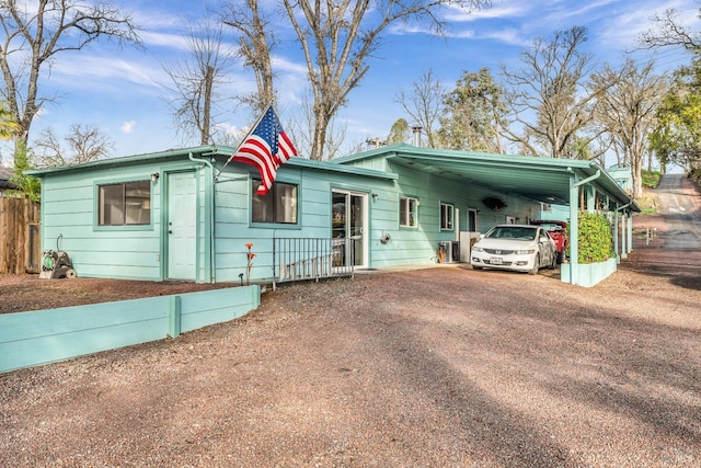 ranch-style house with a carport