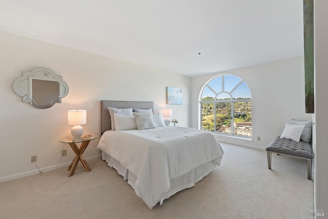 bedroom featuring light colored carpet