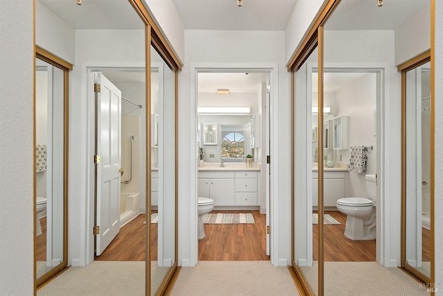 hall with light hardwood / wood-style floors