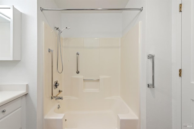 bathroom featuring vanity and bathing tub / shower combination