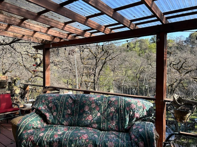 wooden terrace featuring a pergola and an outdoor hangout area