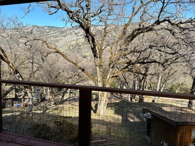 wooden terrace featuring a mountain view