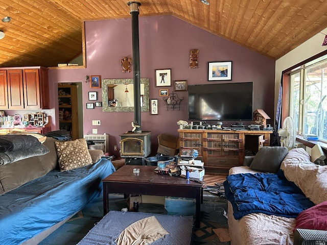 living room featuring a wood stove, high vaulted ceiling, wooden ceiling, and hardwood / wood-style flooring