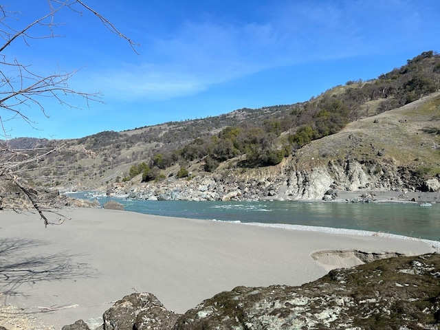 property view of water featuring a view of the beach