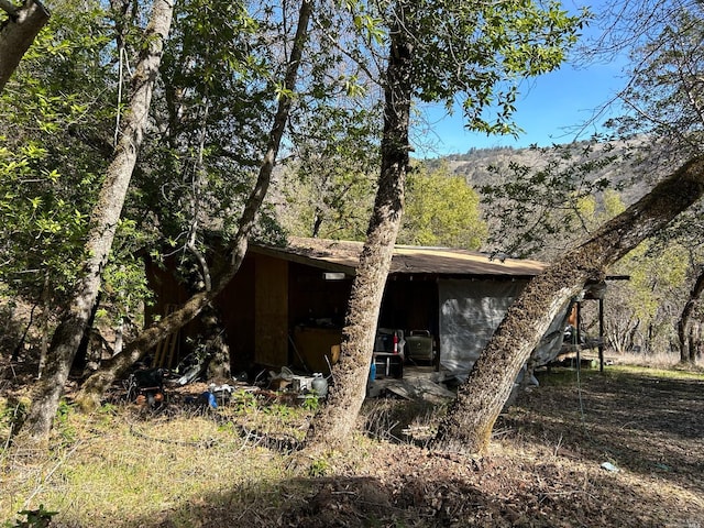 view of home's exterior featuring a mountain view