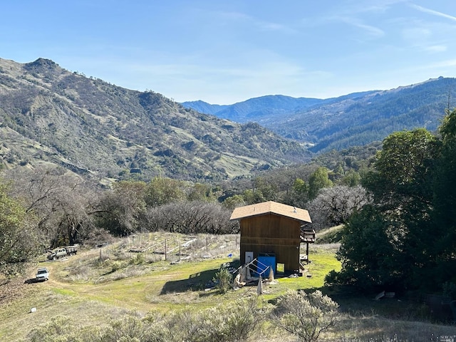 view of mountain feature with a rural view