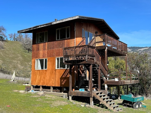 back of property with a wooden deck