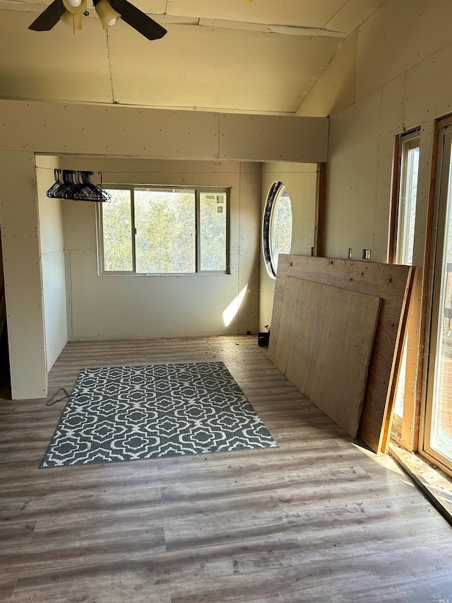 interior space with vaulted ceiling and ceiling fan