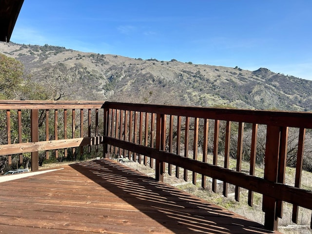 wooden deck featuring a mountain view