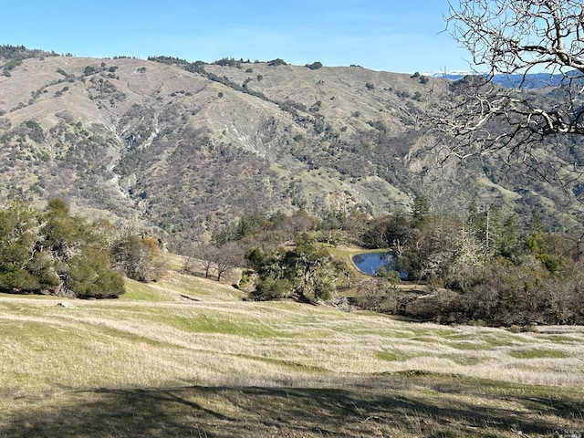 property view of mountains featuring a water view