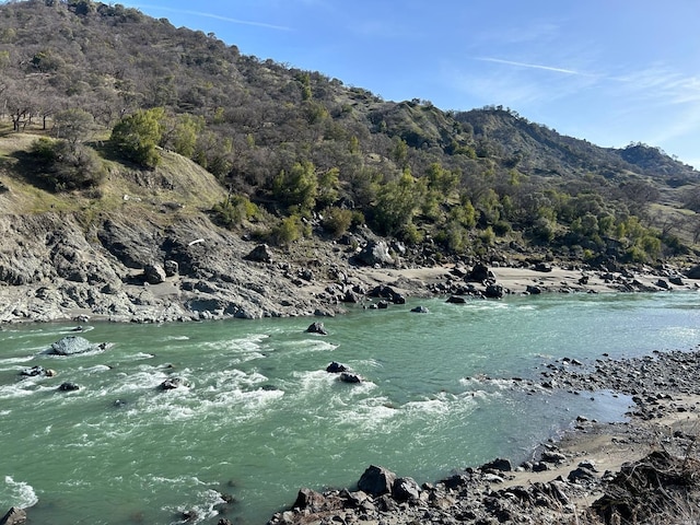 property view of water featuring a mountain view