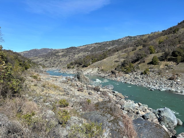 view of mountain feature featuring a water view