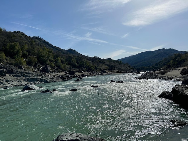 property view of mountains featuring a water view