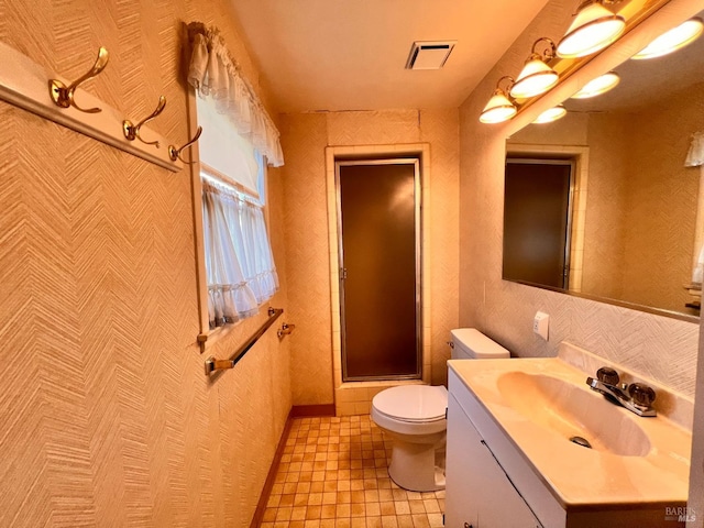 bathroom featuring oversized vanity, tile flooring, and toilet