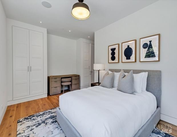 bedroom featuring light wood-type flooring